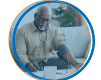 A man with a blood pressure cuff monitoring his vitals from home showing the benefits of digital health for promoting health equity in California.