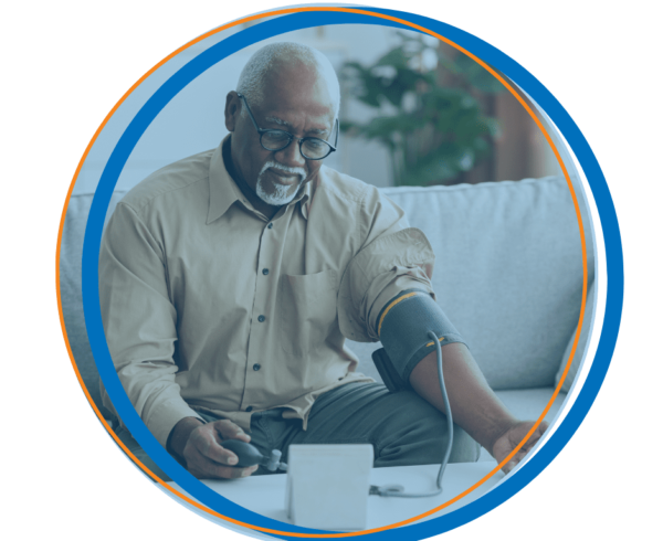 A man with a blood pressure cuff monitoring his vitals from home showing the benefits of digital health for promoting health equity in California.